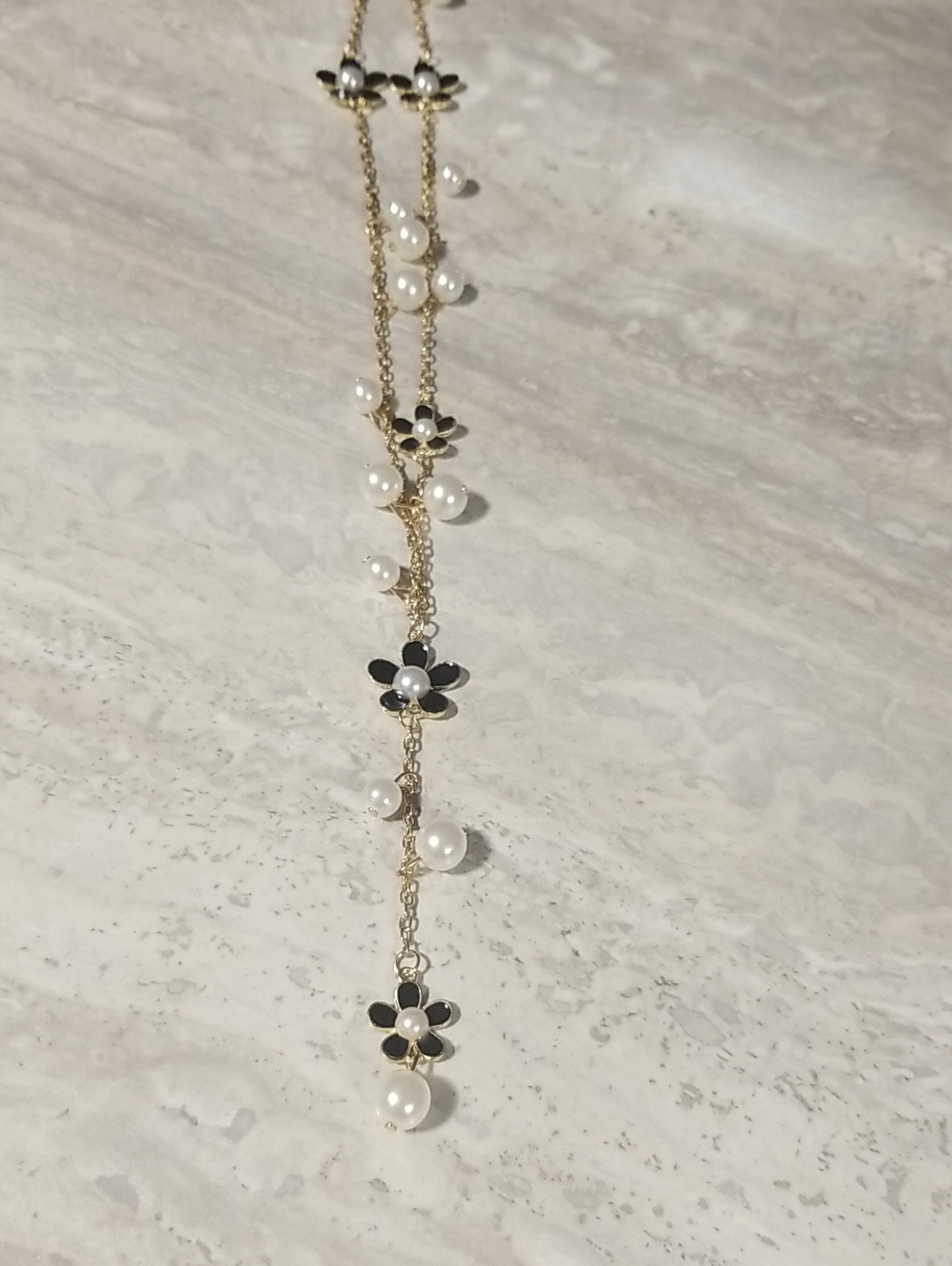 Gold Chain Necklace with Black Flower Accents and White Pearls